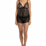 Woman wearing a black lace lingerie set on a white background