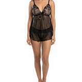 Woman wearing a black lace lingerie set on a white background