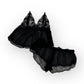 Flatlay black lace lingerie set on a white background