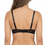Woman wearing a black lingerie set on a white background