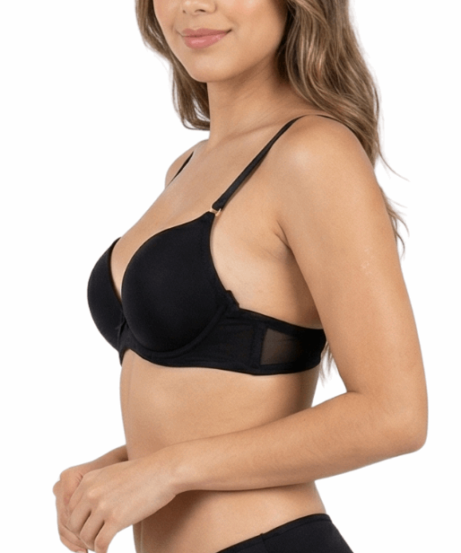 Woman wearing a black bra and panties set on a white background