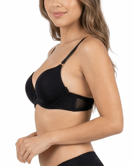 Woman wearing a black bra and panties set on a white background