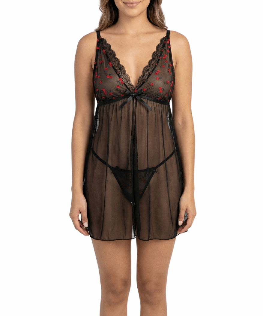 Woman wearing a black lace lingerie set on a white background