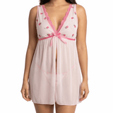 Woman wearing a pink lace nightgown on a white background