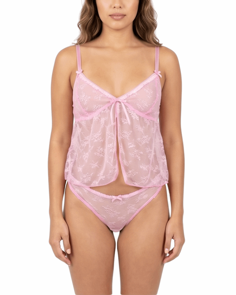 Woman wearing a pink lace lingerie set on a white background