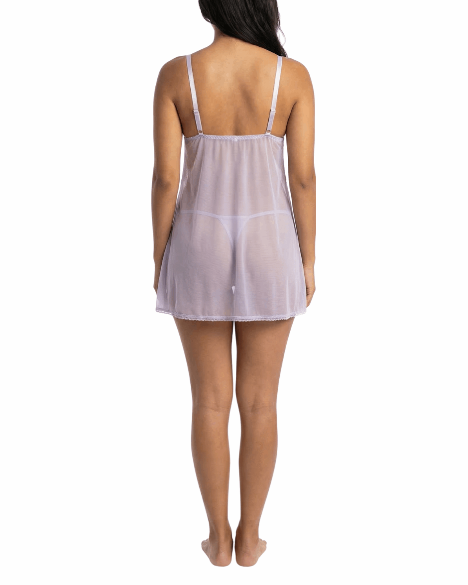 Woman wearing a sheer nightgown on a white background