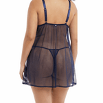 Woman wearing a sheer navy nightgown on a white background