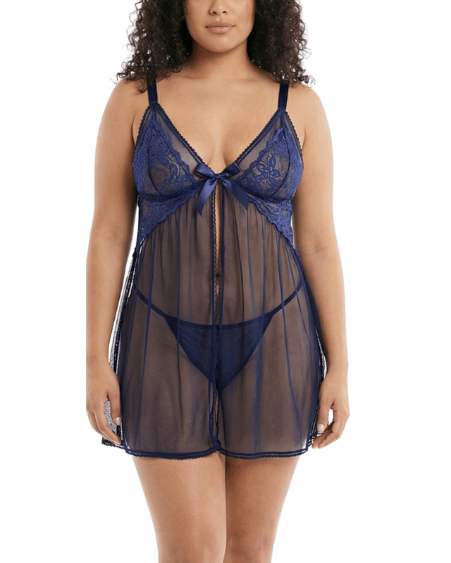 Woman wearing a navy blue lace nightgown on a white background