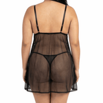 Person wearing a sheer black nightgown on a white background