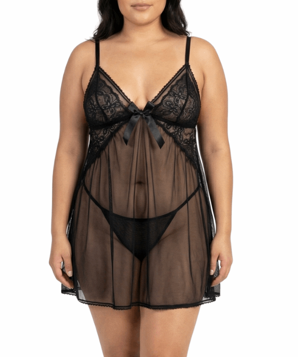 Woman wearing a black lace lingerie set on a white background