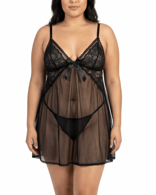 Woman wearing a black lace lingerie set on a white background