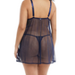 Woman wearing a sheer navy nightgown on a white background