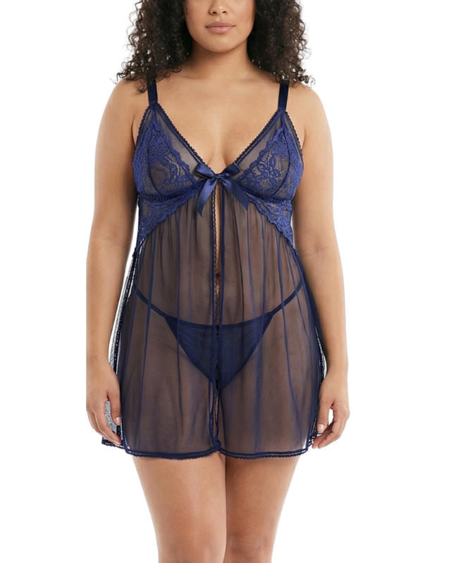 Woman wearing a navy blue lace nightgown on a white background
