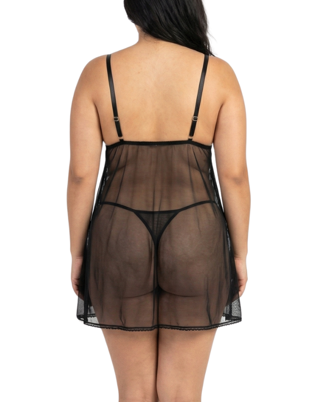 Person wearing a sheer black nightgown on a white background