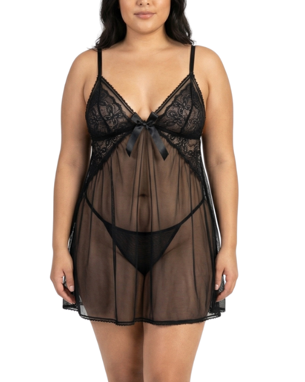 Woman wearing a black lace lingerie set on a white background