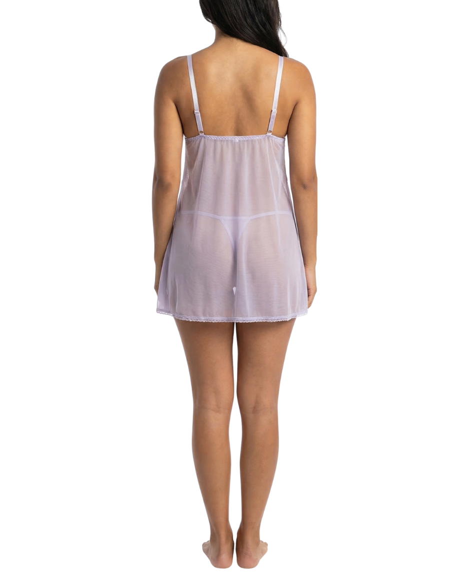 Woman wearing a sheer nightgown on a white background