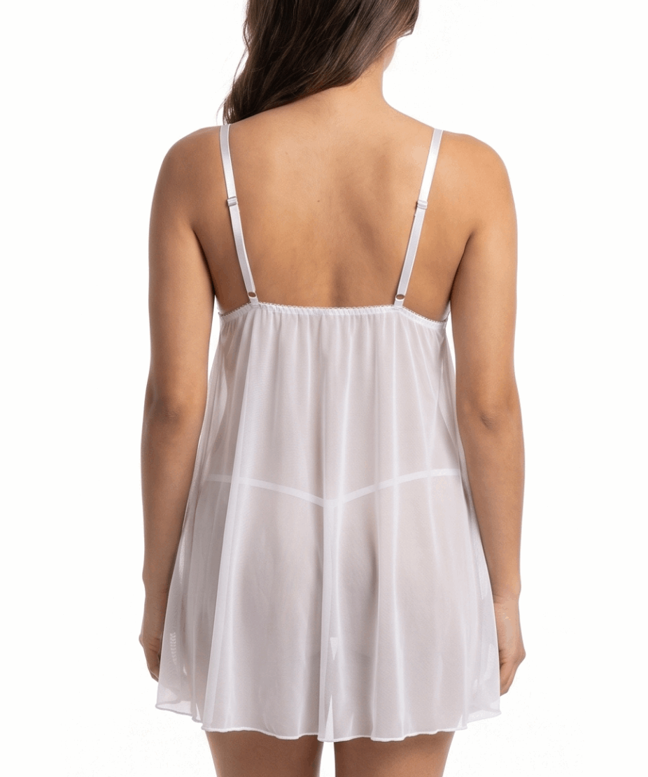 White babydoll dress worn by a model on a white background