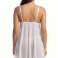 White babydoll dress worn by a model on a white background