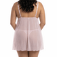 Woman wearing a sheer pink nightgown on a white background