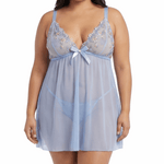 Woman wearing a light blue lace nightgown on a white background
