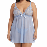 Woman wearing a light blue lace nightgown on a white background
