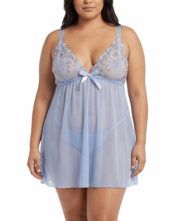 Woman wearing a light blue lace nightgown on a white background