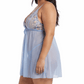 Woman wearing a light blue lace nightgown on a white background