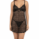 Woman wearing a black lace lingerie set on a white background