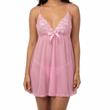 Woman wearing a pink lace nightgown on a white background