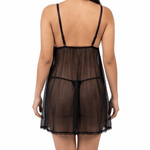 Woman wearing a sheer black nightgown on a white background
