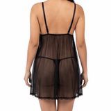 Woman wearing a sheer black nightgown on a white background