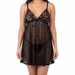 Woman wearing a black lace nightgown on a white background