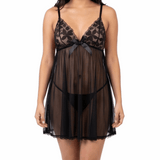Woman wearing a black lace nightgown on a white background