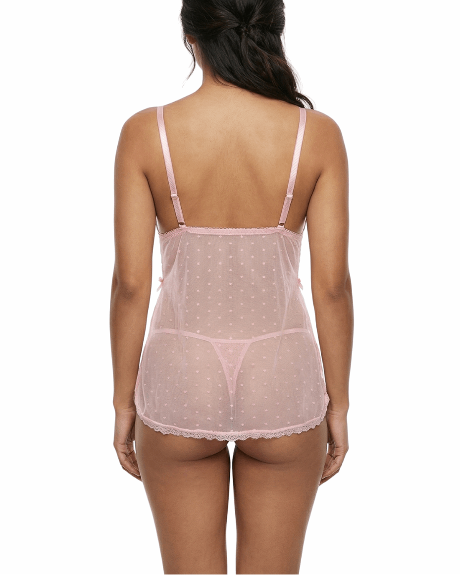 Woman wearing a sheer pink nightgown on a white background