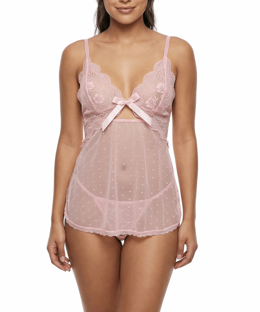 Woman wearing a pink lace lingerie set on a white background