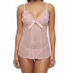 Woman wearing a pink lace lingerie set on a white background