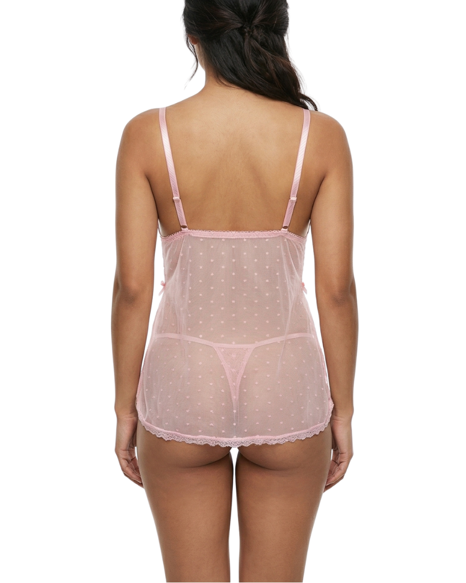 Woman wearing a sheer pink nightgown on a white background