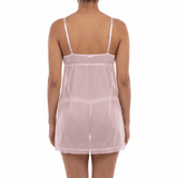 Woman wearing a sheer pink nightgown on a white background