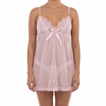 Woman wearing a sheer pink nightgown on a white background