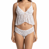 Woman wearing a white lace lingerie set on a white background