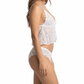 Woman wearing a white lace lingerie set on a white background