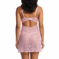 Woman wearing a pink lace nightgown on a white background