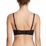 Woman wearing a black bra on a white background