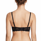 Woman wearing a black bra on a white background