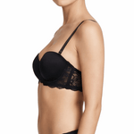 Woman wearing a black bra on a white background