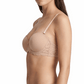 Woman wearing a beige bra and panties set on a white background