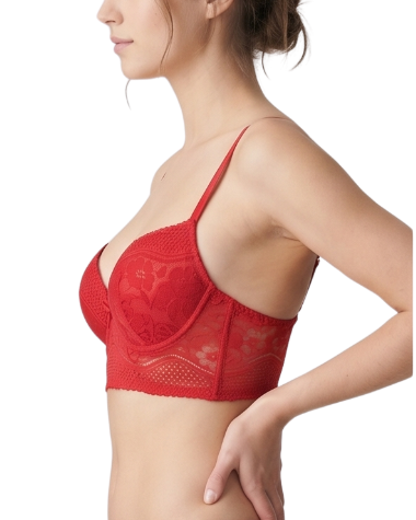 Woman wearing a red bra on a white background