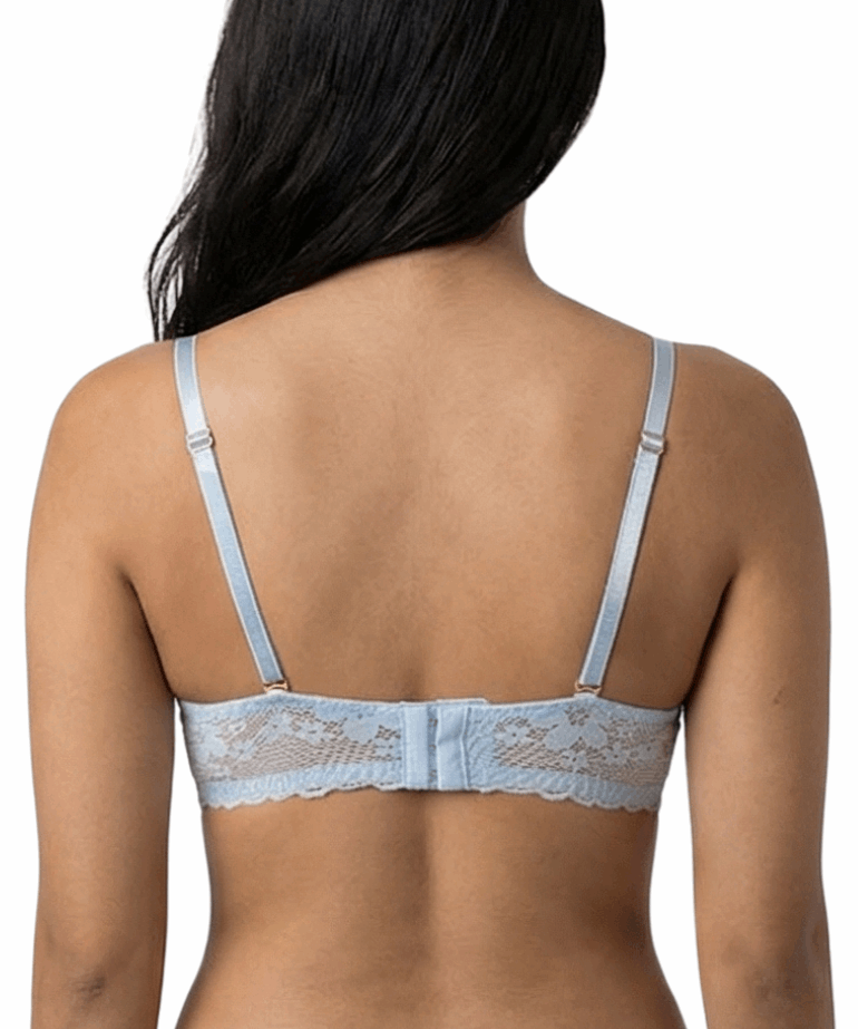 Woman wearing a light blue bra against a white background