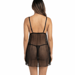 Woman wearing a sheer black nightgown on a white background