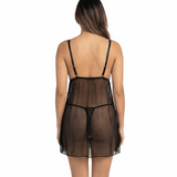 Woman wearing a sheer black nightgown on a white background